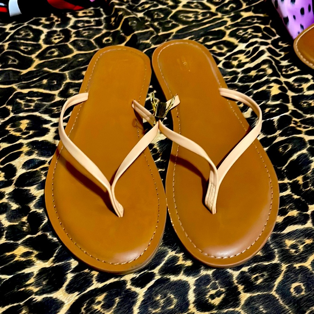 Tan/peach flip flops